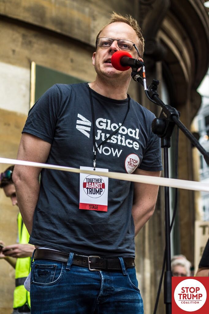 Nick Dearden speaking on stage at the Stop Trump event